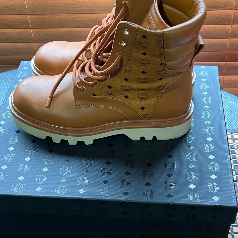 Mcm boots new style worn twice comes with box and receipt and original.